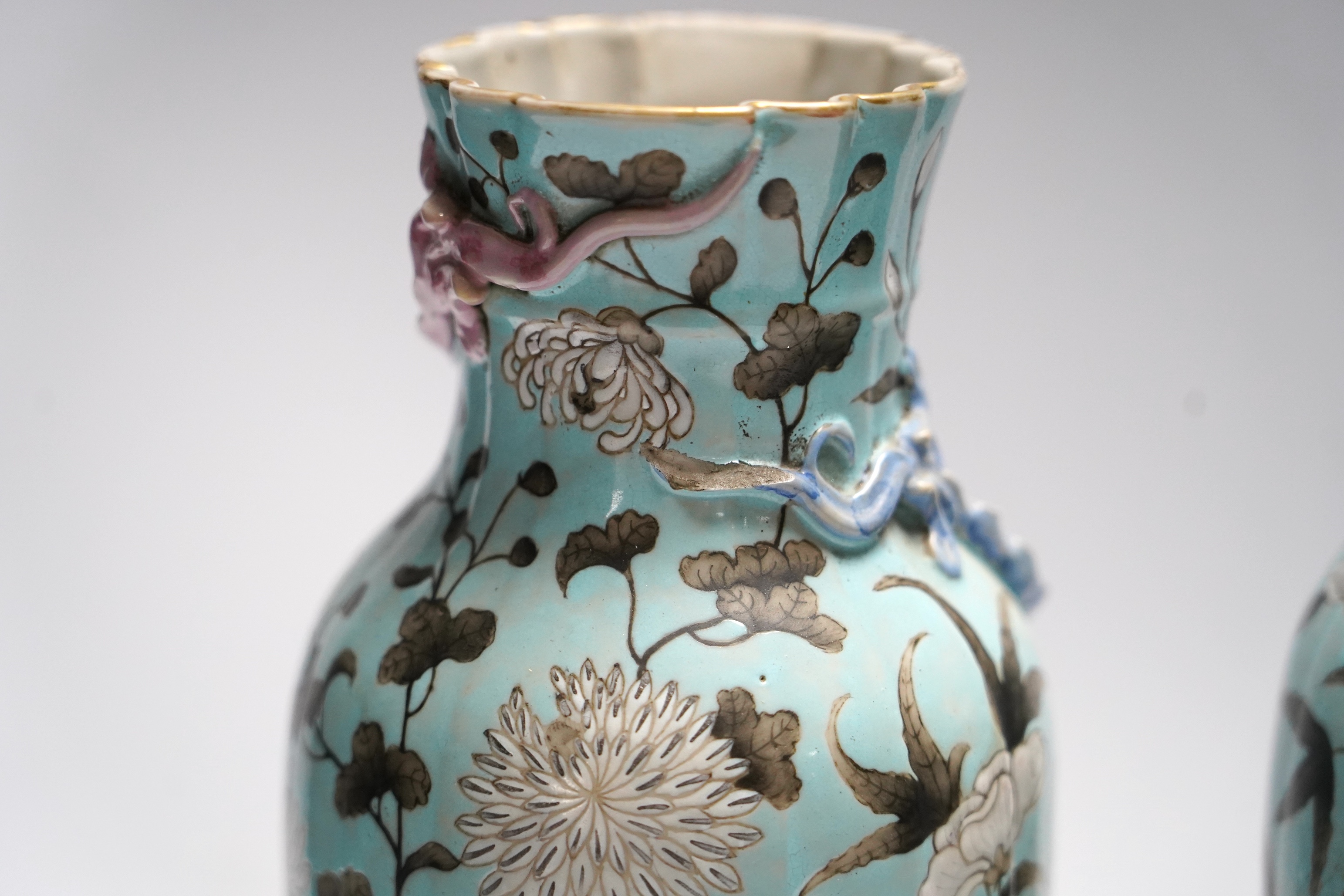 A pair of late 19th century Chinese blue glazed ‘dragon’ vases, 26cm high